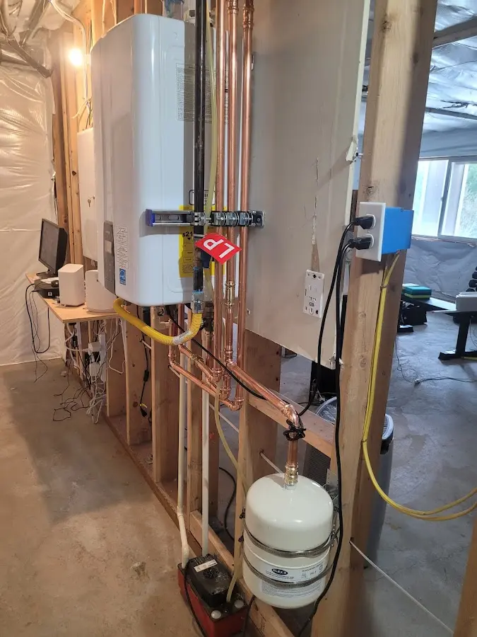Licensed plumber repairing a kitchen sink in Norman